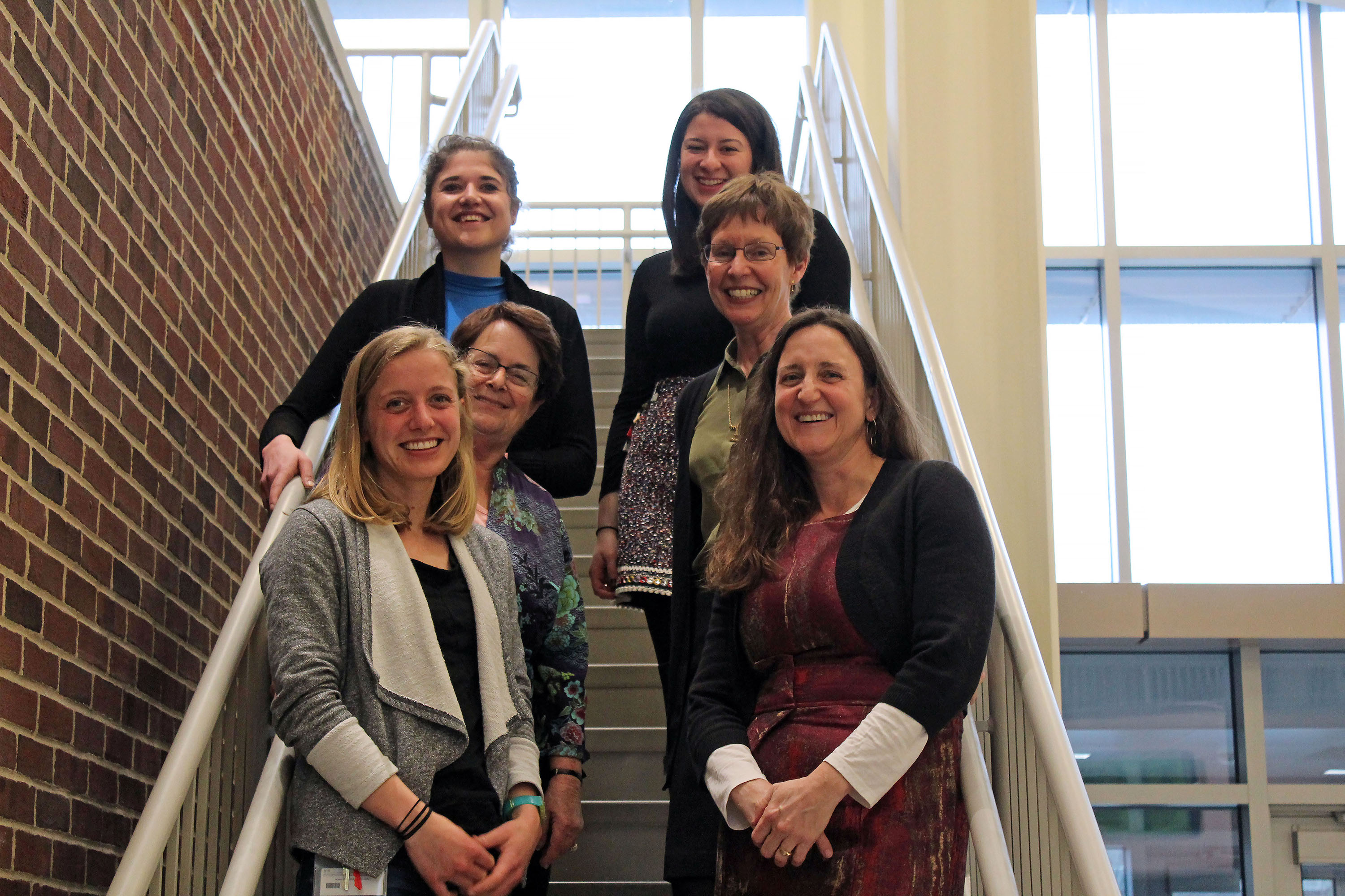 Inge-Marie Eigsti (front row right) and Deborah Fein (second row left), professors in UConn's Department of Psychological Sciences, with members of their research team. (Carson Stifel/UConn Photo)