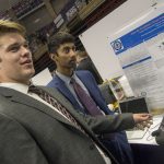 Ross Brancati '18 (ENG), left, and Kryshan Appalaraju '18 (ENG), seniors majoring in biomedical engineering, present the prosthetic limb sensors they created to collect data reporting discomfort in the limb. The sensors measure force, temperature, humidity, and heart rate, and are used to make the prosthetic more comfortable for the user. (Garrett Spahn '18 (CLAS)/UConn Photo)