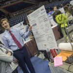 Connor Leahy '18 (ENG), a senior majoring in mechanical engineering, presents his group's research on how to cool down jet engines when they are in use. (Garrett Spahn '18 (CLAS)/UConn Photo)