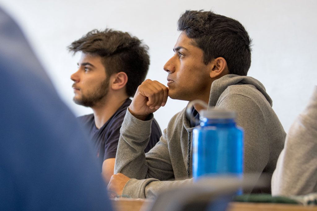 Student-athlete Nabeel Khan ‘19 (ENG) listens to a lecture on heat transfer in Laurel Hall. (Sean Flynn/UConn Photo)