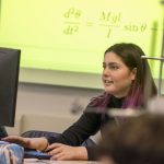 Undergraduate Anna Regan in an introductory course for physics majors. (Garrett Spahn '18 (CLAS)/UConn Photo)