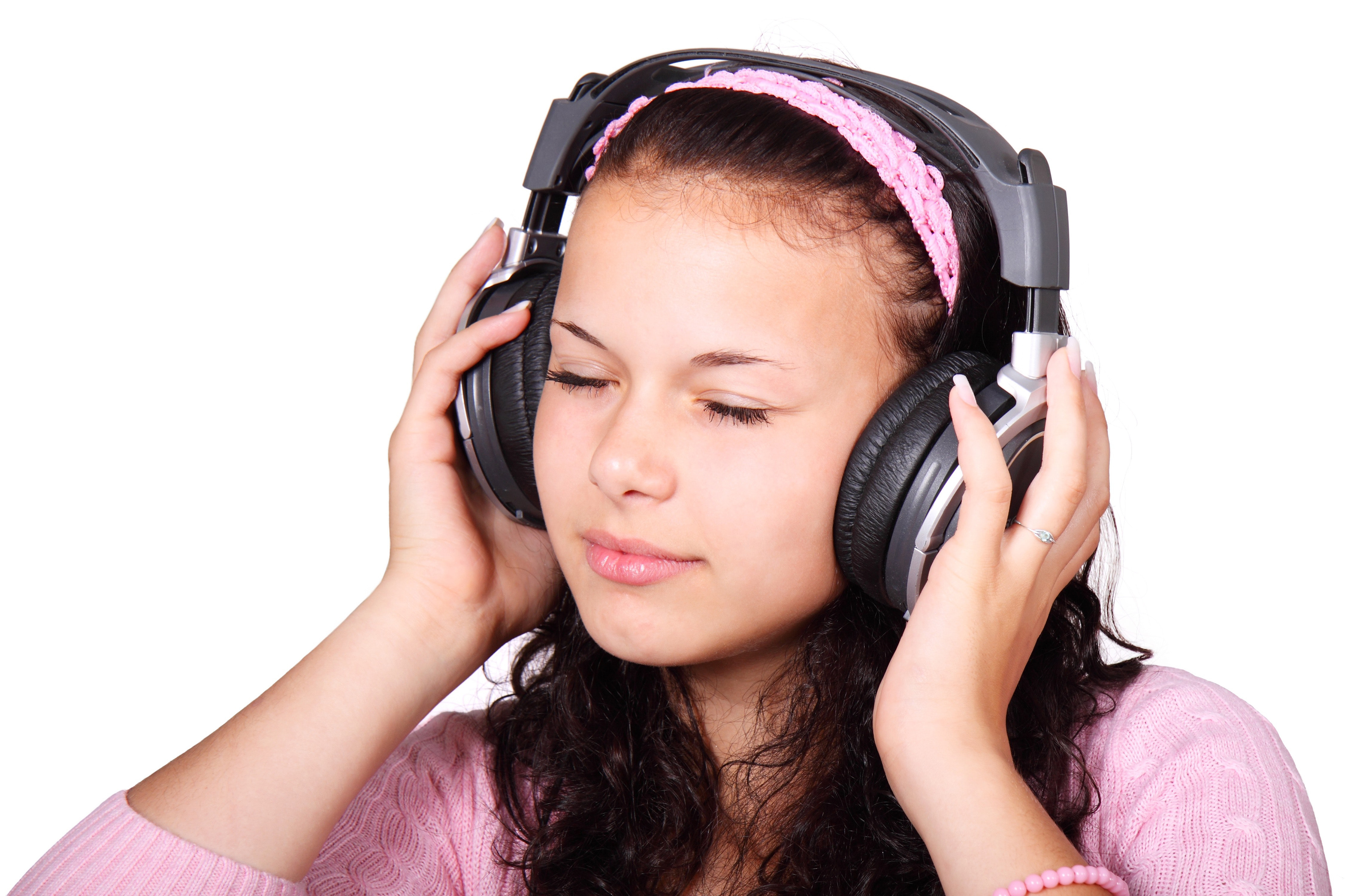 A girl listens to music via headphones. (Pixabay Photo)