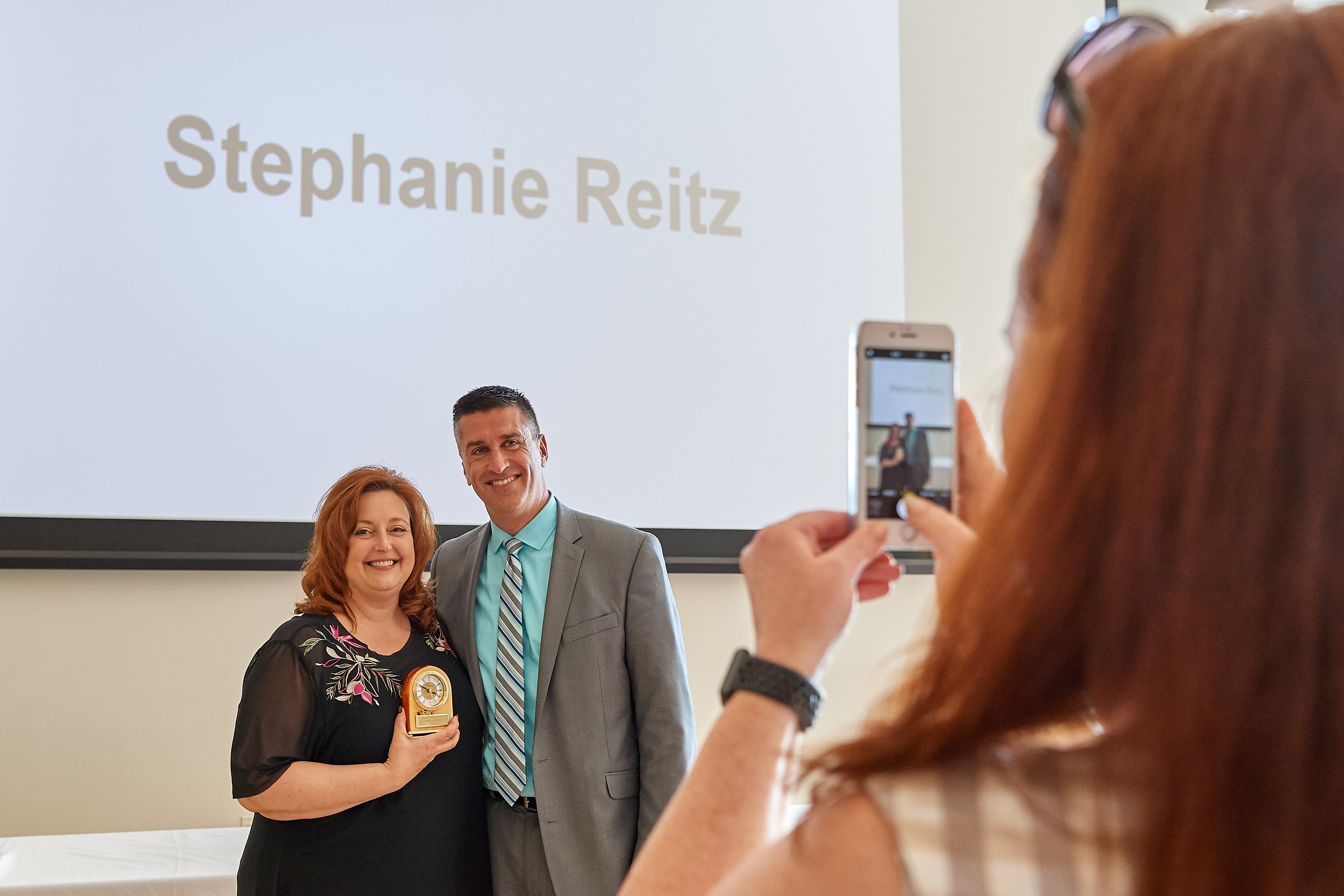 University spokesperson Stephanie Reitz, shown here with Vice President Tysen Kendig, was among those recognized for their contributions to student life at the 2018 Division of Student Affairs Awards Program in the Student Union Ballroom on May 2. (Peter Morenus/UConn Photo)