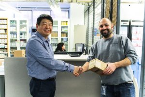 Director of UConn's BioSupply Facility, Xiaoyang Liu (left), meeting with a member of UConn's research community. (Carson Stifel/UConn Photo)