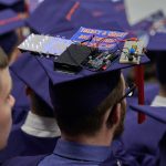 Dillon Johnson '18 (ENG) wears a cap with computer-controlled lights during the School of Engineering Commencement ceremony. (Peter Morenus/UConn Photo)