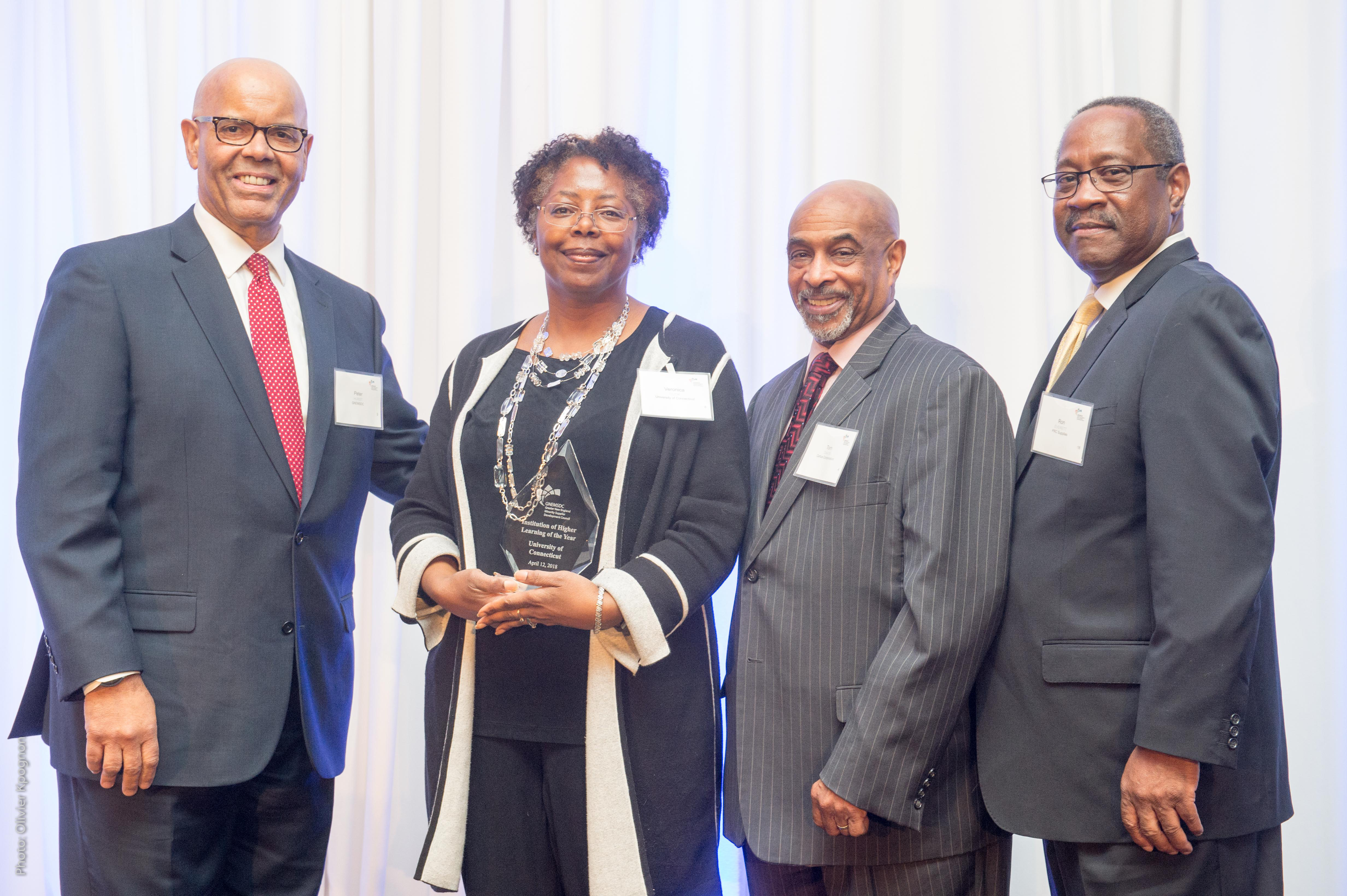 Veronica Cook, program director for the UConn Supplier Diversity Program, second from left, with from left, Peter F. Hurst Jr., President & CEO of GNEMSDC; T. Tom Davis, Chairman, GNEMSDC Board of Directors; and Ron Everett, GNEMSDC Board of Directors. (Olivier Kpognon Photo)