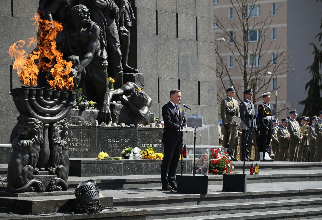 Polish President Andrzej Duda speaks at a memorial to the Warsaw Ghetto Uprising during the main commemoration ceremony of the 75th anniversary of the uprising on April 19, 2018 in Warsaw, Poland. The Warsaw Ghetto was a prison created by the German military during its occupation of Warsaw during World War II. Starting in 1940, 400,000 Jews were confined to a walled-in neighborhood of 3.4 square kilometers under horrific conditions. With assistance from Polish partisans the Jews rose up in armed resistance in 1943 and held off the Germans for several weeks until the Germans annihilated the ghetto, killing 13,000 people. In all 392,000 Jews from the Warsaw ghetto were killed, most of them after deportation to the Treblinka death camp. (Photo by Sean Gallup/Getty Images)