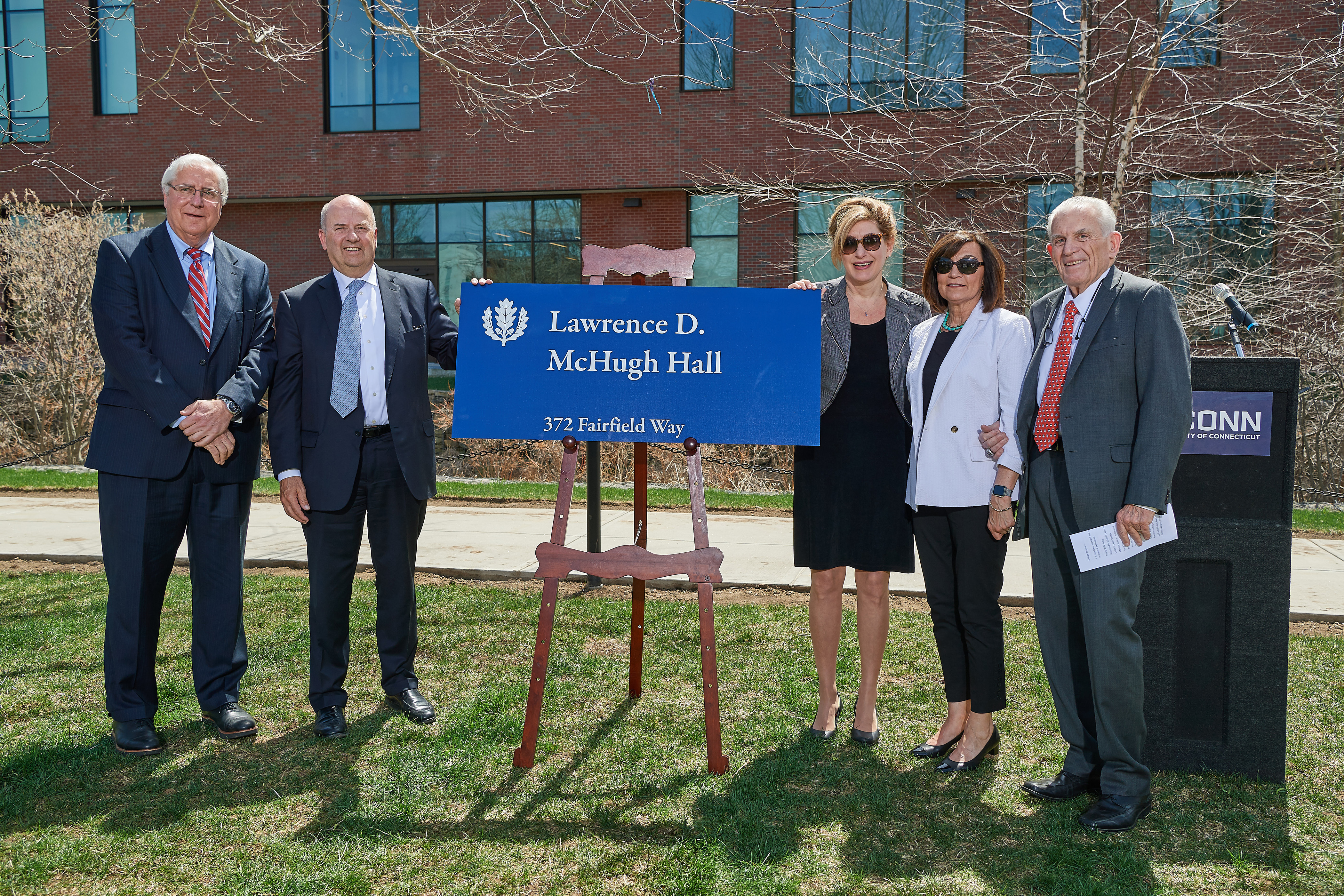 From left, Thomas Ritter '77 JD, Thomas Kruger, President Susan Herbst, Patricia McHugh, and Larry McHugh at the ceremony held to celebrate the naming of Lawrence D. McHugh Hall on May 2, 2018. (Peter Morenus/UConn Photo)