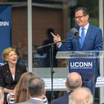 Gov. Dannel Malloy, right, and President Susan Herbst share a laugh at the dedication of the Engineering & Science Building on June 11, 2018. (Peter Morenus/UConn Photo)