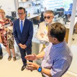 Ki Chon, head of biomedical engineering, shows Gov. Dannel Malloy and others a smart band for measuring heart rate during a tour of the the Engineering & Science Building on June 11, 2018. (Peter Morenus/UConn Photo)
