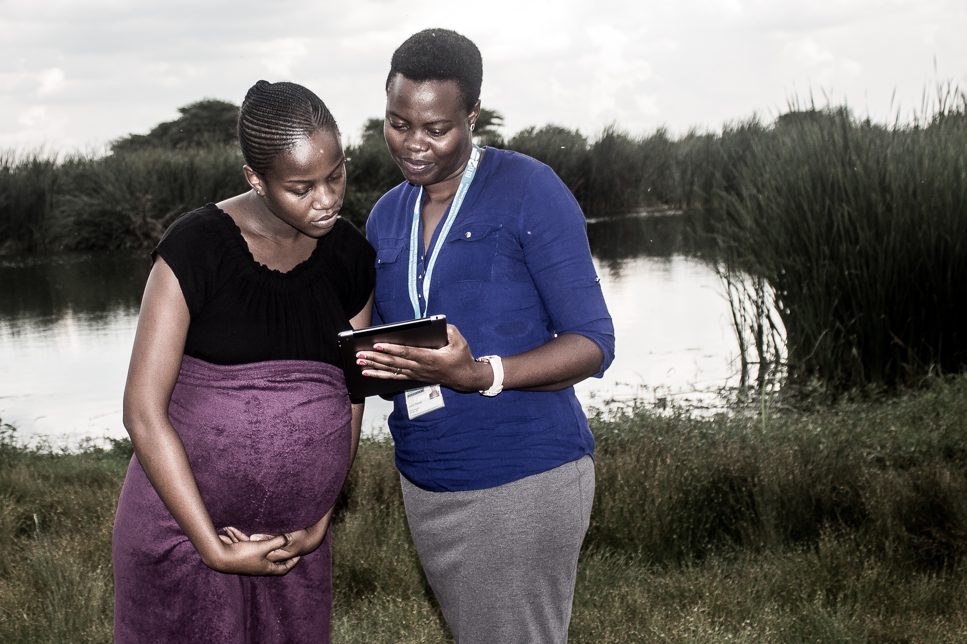 A young mother in Botswana speaks with a health worker. (Moses Mpata/Photo courtesy of the Gates Foundation)