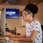 Aubryana Lynch '18 (CLAS), an MSW student, uses a computer at the UConn Hartford Library inside the Hartford Public Library on June 19, 2018. (Peter Morenus/UConn Photo)