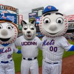 Jonathan the Husky, center, with Mrs. Met, left, and Mr. Met before a New York Mets baseball game at Citi Field in Queens New York on June 3, 2018. (Peter Morenus/UConn Photo)