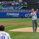 Dan Hurley, right, head coach of UConn Men's Basketball, throws out the ceremonial first pitch to be caught by Rob Stone, '09 (CLAS), left, vice president for business development at SS&C Technologies at a New York Mets baseball game at Citi Field in Queens New York on June 3, 2018. (Peter Morenus/UConn Photo)