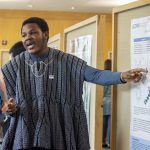 Richmond Apore '19 (CLAS), a biological sciences major, speaks about his research at the McNair Scholars Poster Session on July 25, 2018. (Christine Buckley/UConn Photo)