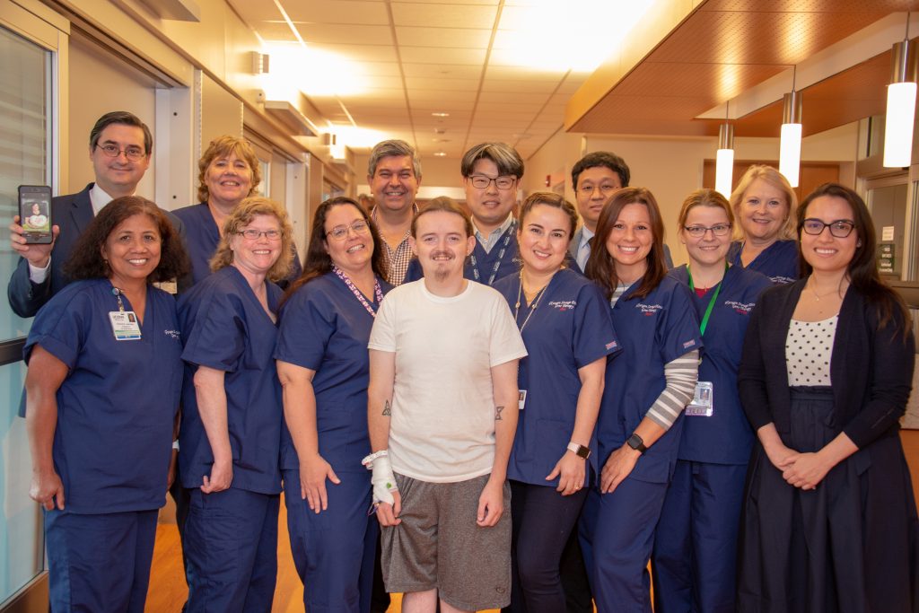 Dr. David Weinstein, back row left, with the team that administered the first-of-its-kind gene therapy to GSD patient Jerrod, front row center, at UConn John Dempsey Hospital. (Tina Encarnacion/UConn Health Photo)