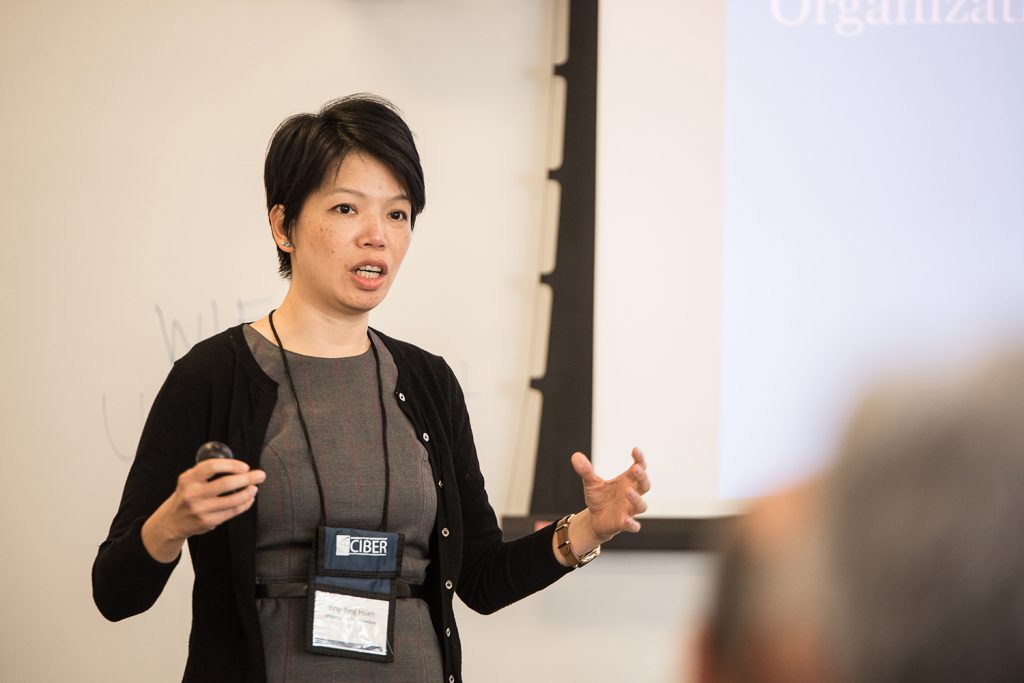 Ying-Ying Hsieh, a professor at Imperial College London, explains her research on reconceptualizing organizational governance at UConn's Blockchain Technology & Organizations Research Symposium on Aug. 14 in Stamford. The event drew two dozen faculty and researchers from around the globe. (Nathan Oldham/UConn photo)