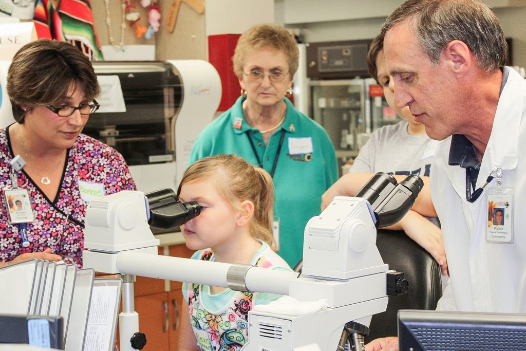 A participant gets “a close up look at cancer” in the program at Lawrence Memorial Hospital Oncology in Lawrence, Kansas. (Peter R. van Dernoot)