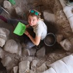 UConn graduate student Roxanne Lebenzon excavating at Nahal Ein Gev II, a 12,000 year-old archaeological site in northern Israel, east of the Sea of Galilee. (Photo by Laura Dubreuil)