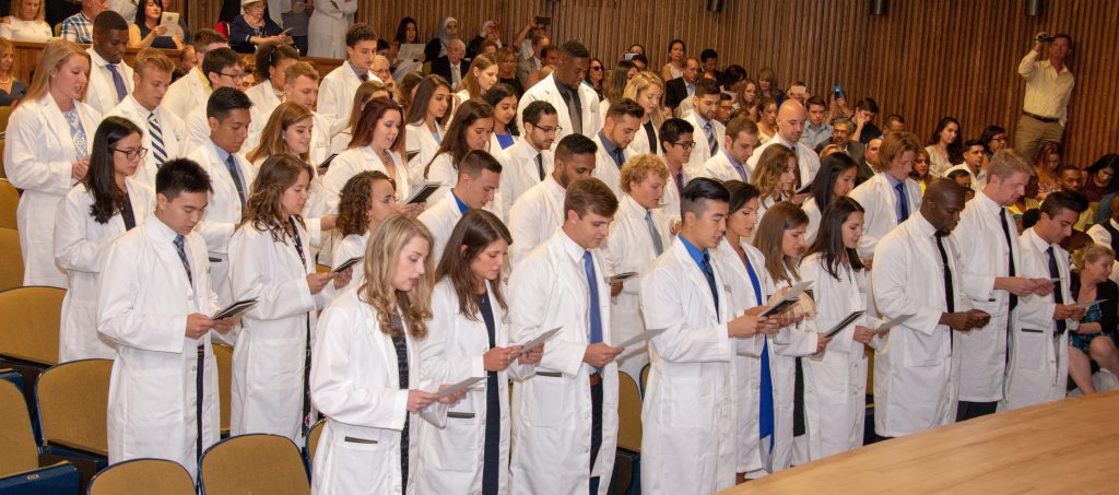 On Aug. 17 UConn School of Dental Medicine Class of 2022 received their white coats at UConn Health and together recited the Dentist Pledge (Tina Encarnacion/UConn Health photo).