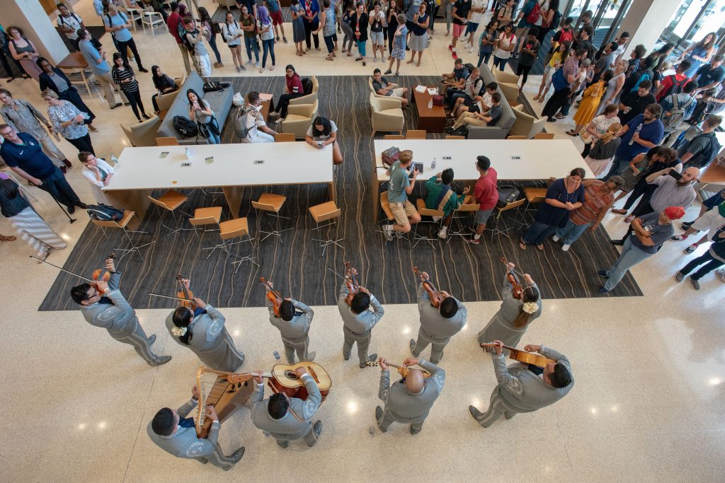 Students, faculty, and staff listen to the Mariachi Mexico Antiguo Band during the Hartford Campus Convocation Celebration in Mortensen Courtyard (atrium) on Aug. 29, 2018. (Sean Flynn/UConn Photo)