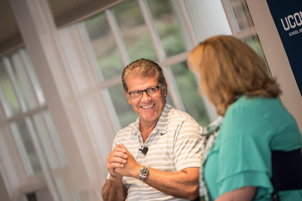 Geno Auriemma, head coach of the UConn Women's Basketball program, shared stories of basketball, leadership and success with the new cohort of the Executive MBA program on Thursday. Lucy Gilson, head of the management department, served as event moderator. (Nathan Oldham/UConn School of Business)