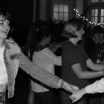 Eliza Bakov '20 (NUR) leads her partner onto the dance floor to begin the night of dancing. (Lucas Voghell/UConn Photo)