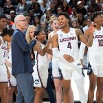 Men's Basketball head coach Dan Hurley gives senior Jalen Adams the thumbs-up during First Night. (Stephen Slade '89 (SFA) for UConn)
