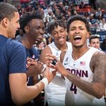 From left Kwintin Williams and Sidney Wilson of the Blue Team share a joke with Brendan Adams and Jalen Adams (no relation) of the White Team. (Stephen Slade '89 (SFA) for UConn)