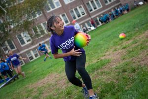 Kate Bruder, a member of Women in Math, Science, and Engineering (WiMSE) House, participates in a dodgeball competition. (Defining Studios Photography for UConn)
