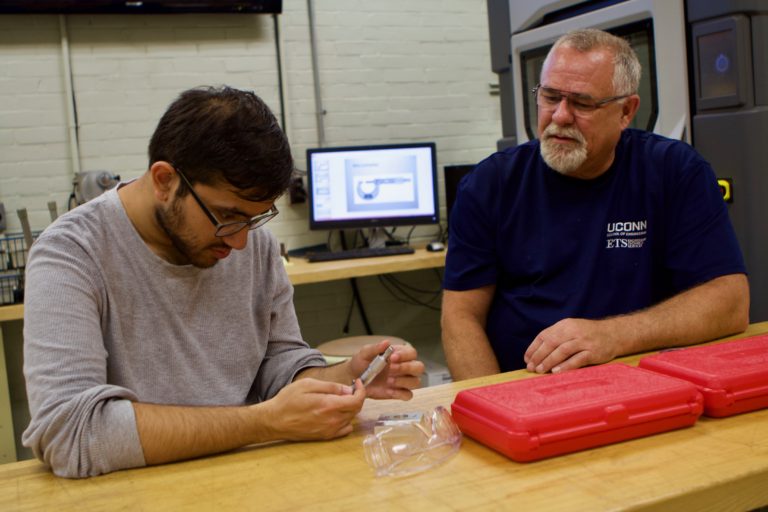 Mark Bouley, right, sits with a UConn Engineering student during safety classes. (UConn Photo/Christopher Larosa)
