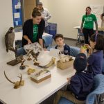 Samantha Apgar, a graduate student in ecology and evolutionary biology, teaches the kids about birds using eggs and taxidermy specimens. (Lucas Voghell '20 (CLAS)/ UConn Photo)