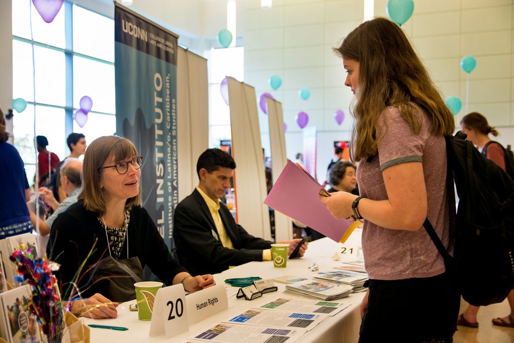 Kathryn Libal, director of the Human Rights Institute and associate professor of social work, speaks with a student at the Major Fair in the Student Union Ballroom on Wednesday, Oct. 10. (Nicholas Hampton '19 (CLAS)/UConn Photo)