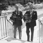 President Albert Jorgensen, left, and Paul Alcorn, university librarian 1934-1959, provided hands-on help with moving books into the new library in 1940. At that time, the building had no name; it was named in 1942 for Wilbur Cross, governor of Connecticut at the time bond issues were approved for construction on campus that included the new library. (University Library Archives & Special Collections)