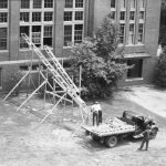 Crates of books were moved into the new library through the windows. (University Library Archives & Special Collections)