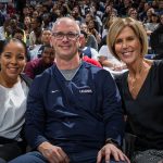 Men's Basketball head coach Dan Hurley (center) with Jasmine Lister, Women's Basketball assistant coach (left) and Chris Dailey, Women's Basketball associate head coach, coached the winning Blue Team during the mixed teams competitions at First Night. (Stephen Slade '89 (SFA) for UConn)