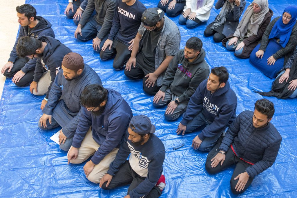 A Muslim prayer service at the Hartford Public Library before a Metanoia event at the Hartford Campus in November 2017. (Sean Flynn/UConn File Photo)