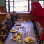 Beni Lopez, 3, is excited to meet Clifford at the Character Breakfast with his sister Amelie, 10, and friend Corryn Tarbell, 10. (Lucas Voghell '20 (CLAS)/UConn Photo)