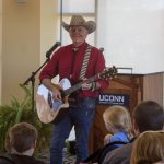 Author, illustrator, and country singer Grant Maloy Smith entertains the crowd with songs after a drawing presentation. (Lucas Voghell '20 (CLAS)/UConn Photo)
