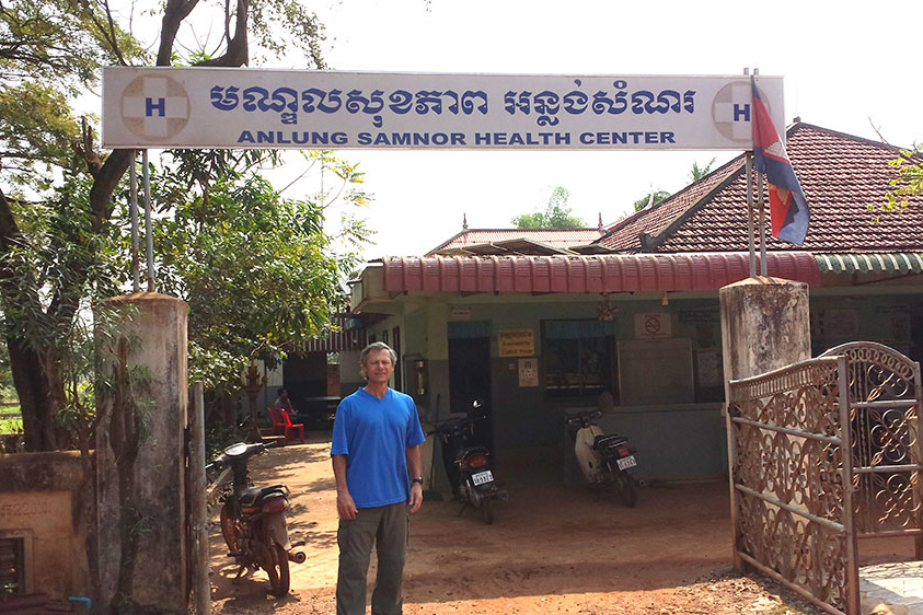 Thomas Buckley, UConn associate clinical professor of pharmacy practice, one of several UConn researchers working with survivors of the Khmer Rouge, at a rural village health clinic in Cambodia during a sabbatical leave. (Courtesy of Tom Buckley)