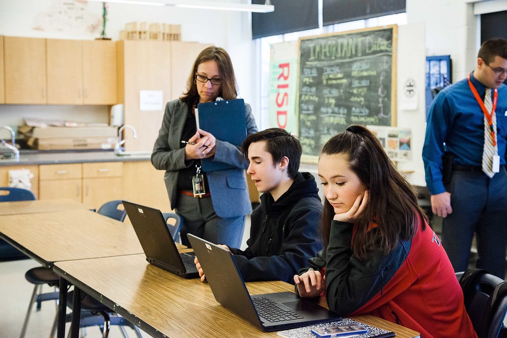 Megan Baker, principal at Tourtellotte High School in Thompson, Connecticut, Baker checks in with students in class as part of her weekly teacher observations. Baker is a graduate of the Neag School's principal training program. (Cat Boyce/UConn Photo)