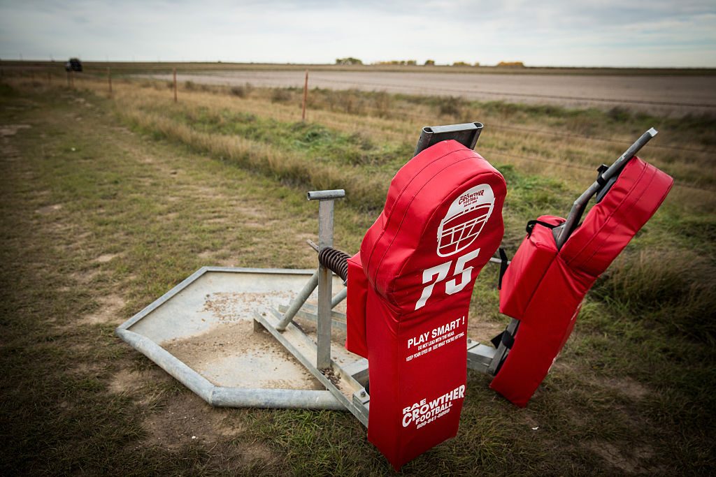 Football practice equipment sits on the practice field. (Photo by Andrew Burton/Getty Images)