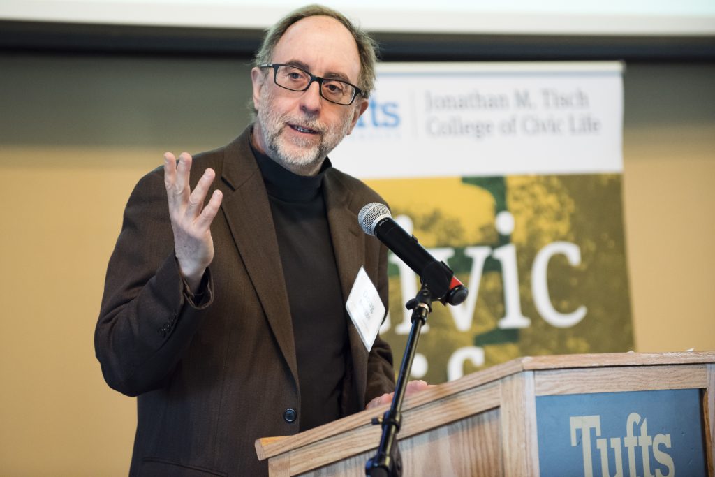 Doug Brugge speaking at Tufts