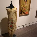 A scarf displayed near a Rand portrait of Anna Delancy Mears wearing a floral shawl. Courtesy of the New Britain Museum of Art.