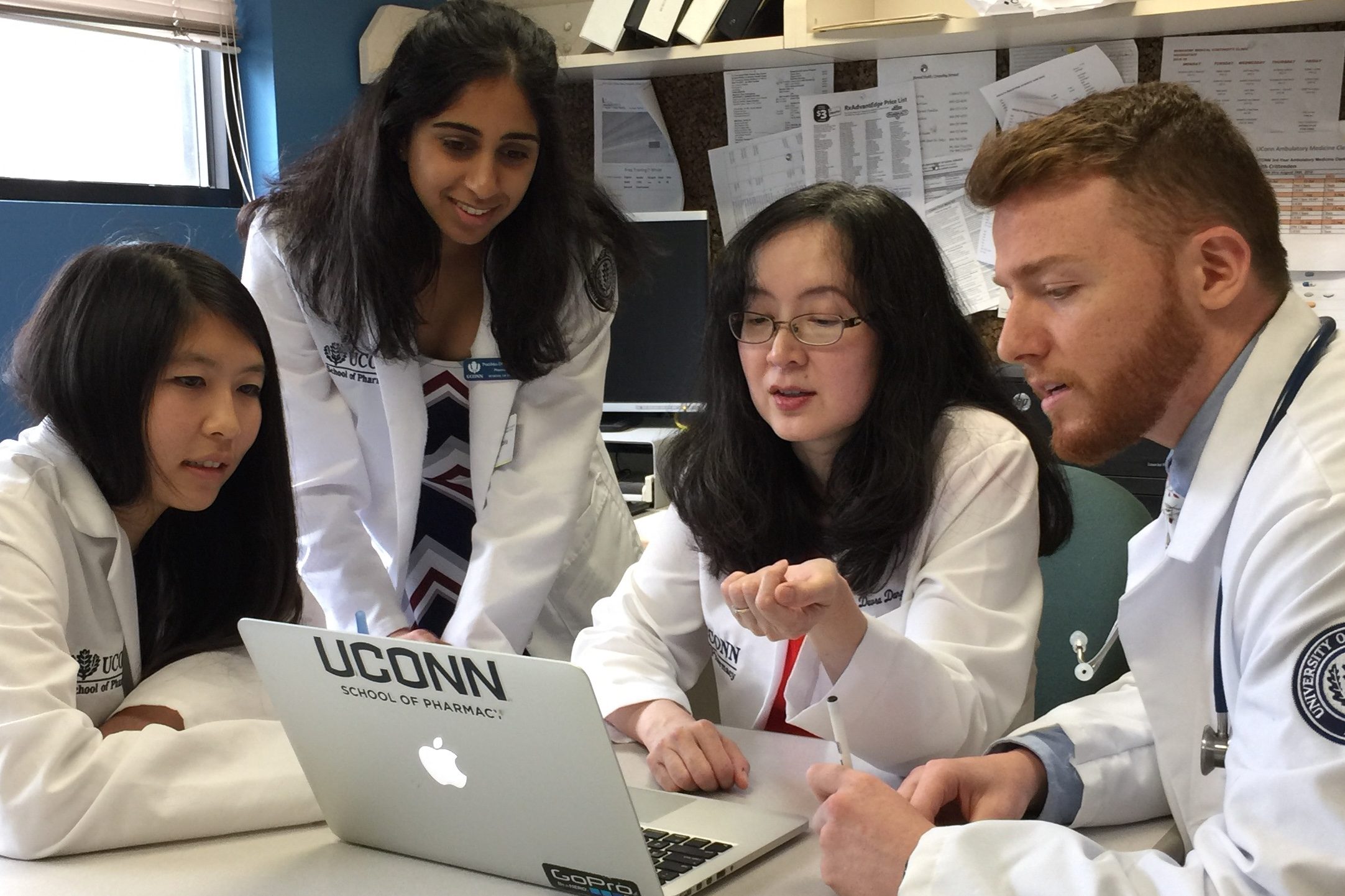 Devra Dang meets with students to discuss a patient's diagnosis.