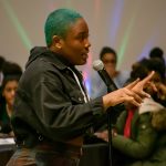 Richelle Gray ’20 (CLAS), an archeology major, delivers a free-verse poem about the struggles of African-American teens in today’s society. (Lucas Voghell ’20 (CLAS)/UConn Photo)