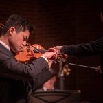 … which was the first movement of 'Violin Concerto in D Minor' by Jean Sibelius, with soloist Andy Peng, a graduate student pursuing a doctorate of fine arts in violin performance, who was this year's Concerto Award recipient. (Lucas Voghell ’20 (CLAS)/UConn Photo)