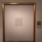 An empty frame with a text block inside, which represents the missing portrait of President Franklin D. Roosevelt that Rand painted in 1934, during his first term.
