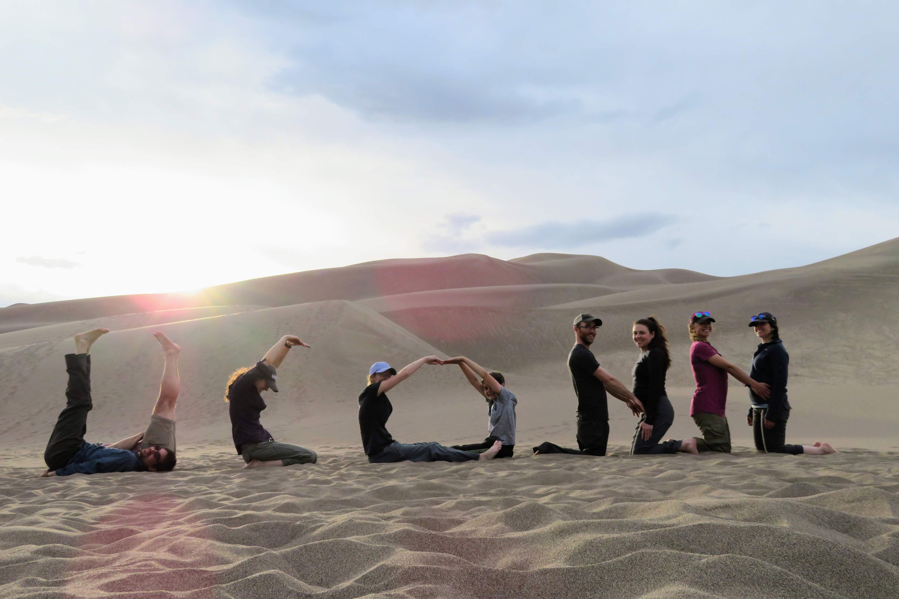 Students on dune: Geosciences students spell 'UConn' in May 2018 at Great Sand Dunes National Park and Preserve, Colorado. The trip was part of a field course, 'Field Geology & Landscapes of the Western U.S.,' which included a two-week field trip to Colorado, Utah, and Arizona. (Will Ouimet/UConn Photo)