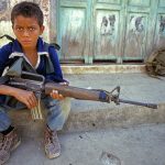 This 12-year-old guerrilla fighter said he joined the rebels after witnessing soldiers kill his parents, Usulután Department, El Salvador, 1989. (Photo by Scott Wallace)